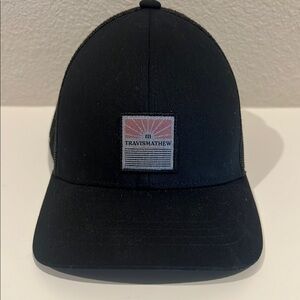 TravisMathew trucker Black Cap with Logo Patch
